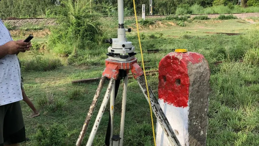 Total station observation against a railway boundary post — BTPL fieldwork on an existing rail corridor, representative of this survey type