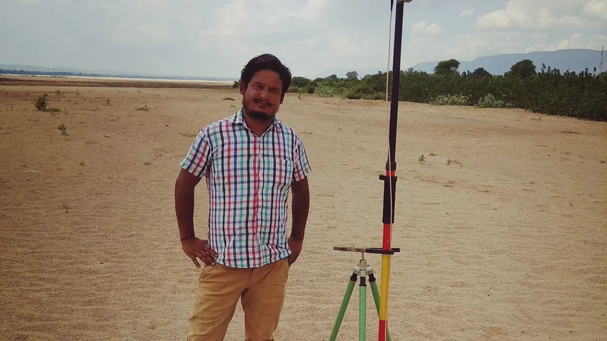 GNSS antenna on cleared ground, set for photogrammetric ground control — representative BTPL fieldwork