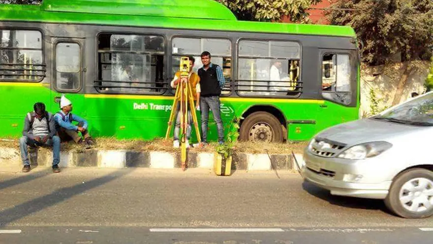 Survey work alongside a Delhi Transport bus — BTPL fieldwork of the kind carried out at terminal sites