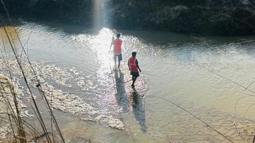 Sounding a river channel on foot with a survey pole — BTPL fieldwork, representative of this survey type