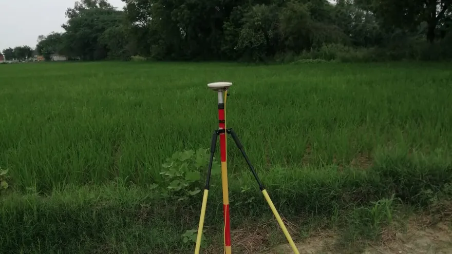 GNSS observation in irrigated farmland of the kind the canal alignment crosses — BTPL fieldwork, representative of this survey type
