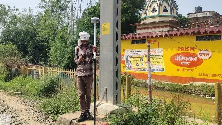 A BTPL surveyor occupying a ground control point with a GNSS rover — a photograph from this project